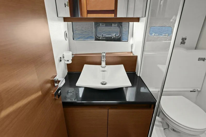 Slide: The Image of Luxurious bathroom in 2014 Prestige 450 S yacht with modern sink and toilet. - 39