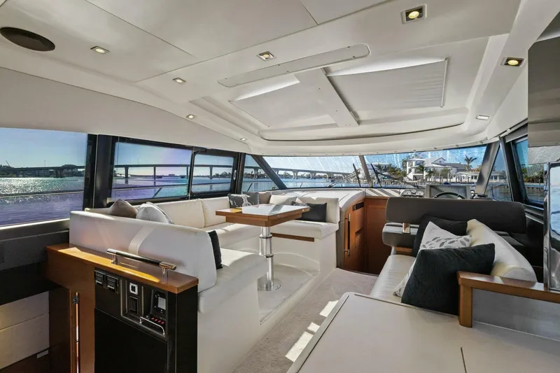 Slide: The Image of Luxurious interior of 2014 Prestige 450 S yacht with elegant seating and panoramic windows. - 4