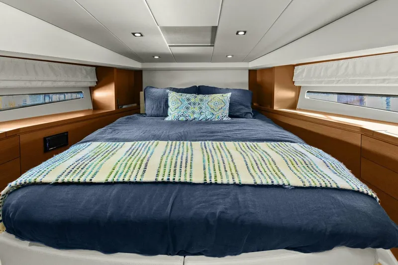 Slide: The Image of Luxurious bedroom interior of 2014 Prestige 450 S yacht with cozy bedding. - 42