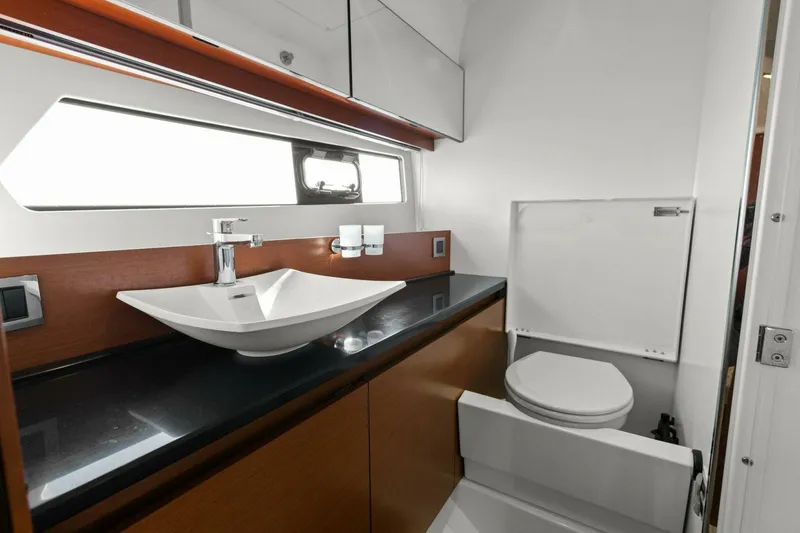 Slide: The Image of Luxurious bathroom in 2014 Prestige 450 S yacht with modern sink and toilet. - 45