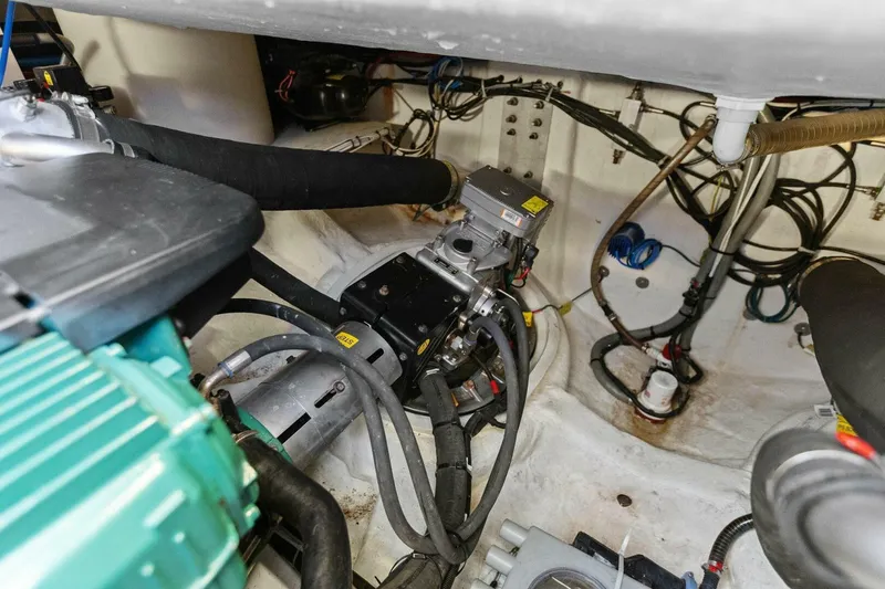 Slide: The Image of Engine compartment of 2014 Prestige 450 S yacht, showcasing mechanical components and wiring. - 48