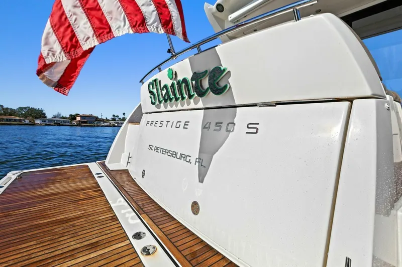 Slide: The Image of Prestige 450 S yacht, 2014 model, docked with American flag, St. Petersburg, FL. - 5