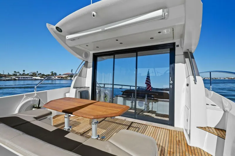 Slide: The Image of Luxury 2014 Prestige 450 S yacht with spacious deck and seating area. - 6