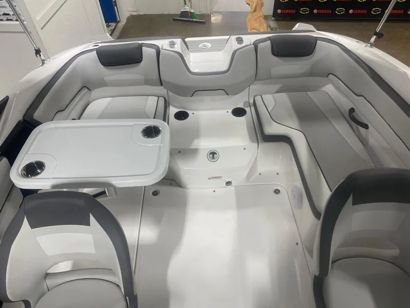 Slide: The Image of 2024 Yamaha Boats SX190 interior with seating and table setup. - 4
