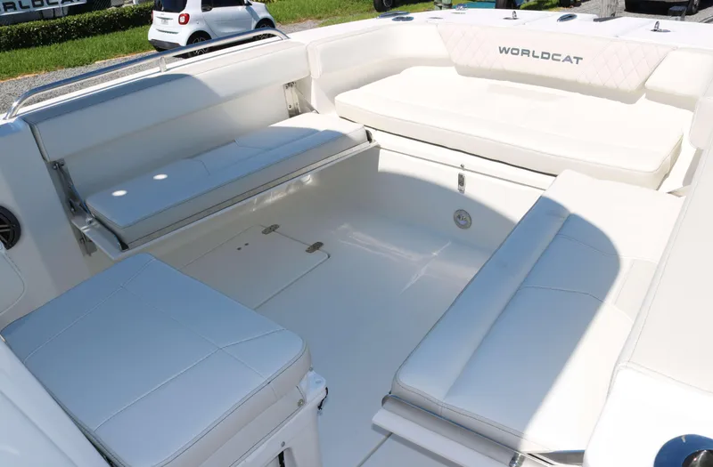 Slide: The Image of 2025 World Cat 235TE boat interior with spacious white seating and modern design. - 11