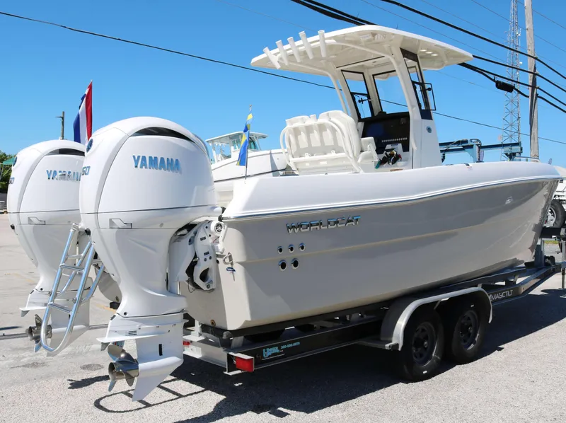 Slide: The Image of 2025 World Cat 235TE boat with twin Yamaha engines on a trailer. - 3