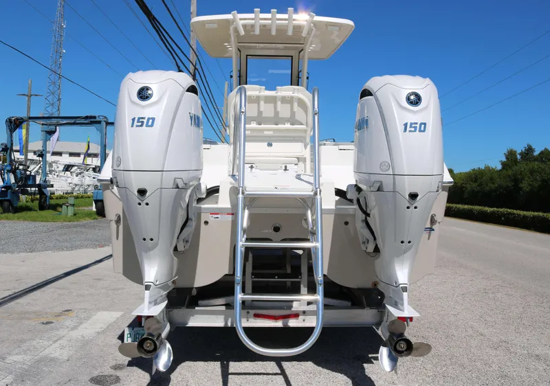 Slide: The Image of 2025 World Cat 235TE boat with dual 150 horsepower engines, rear view. - 4