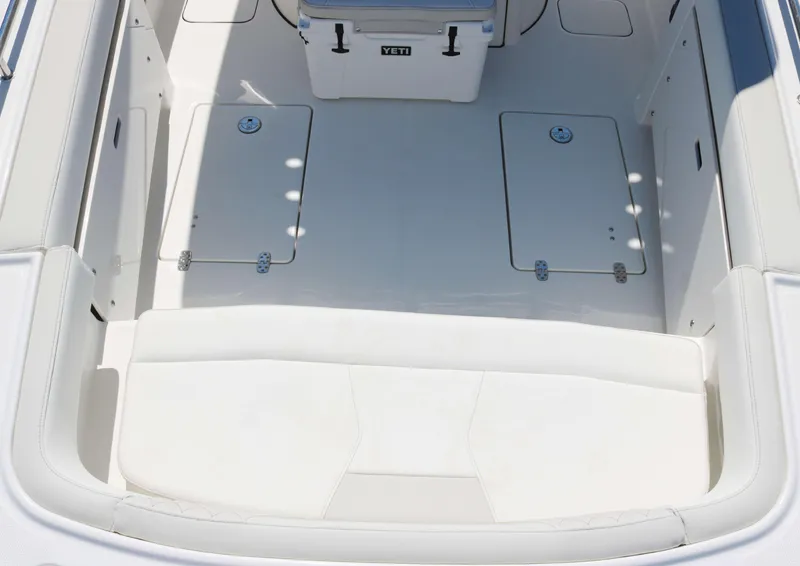 Slide: The Image of Spacious deck of 2025 World Cat 235TE boat with storage compartments. - 8