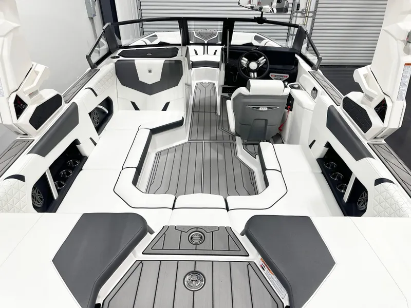Slide: The Image of 2025 Nautique GS20 boat interior with sleek, modern design and spacious seating. - 7