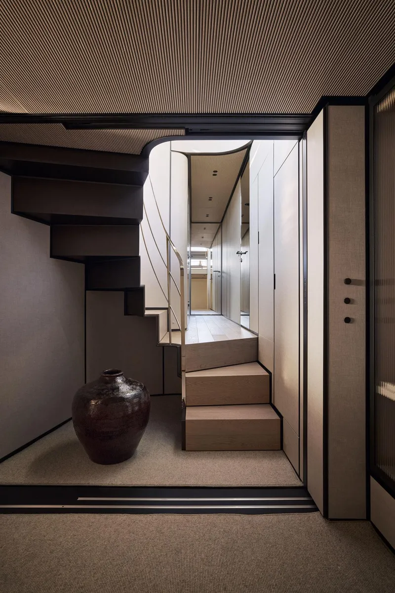 Slide: The Image of Modern interior of 2026 Sanlorenzo SP92 yacht with elegant staircase and decorative vase. - 37