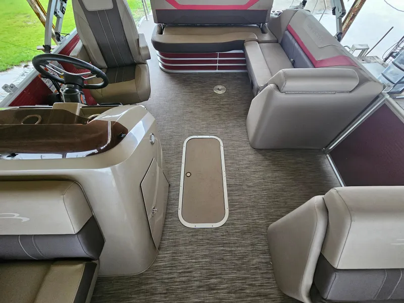 Slide: The Image of 2021 Bennington 22 SX boat interior with plush seating and modern helm. - 10
