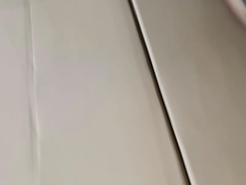 Slide: The Image of Close-up of a 2021 Bennington 22 SX boat's sleek metallic surface. - 25