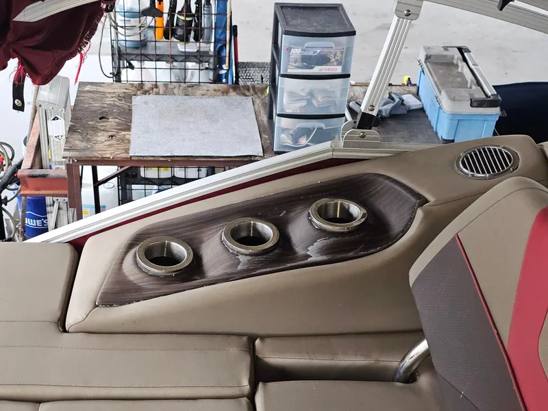 Slide: The Image of Interior of 2021 Bennington 22 SX boat with cup holders and seating. - 26