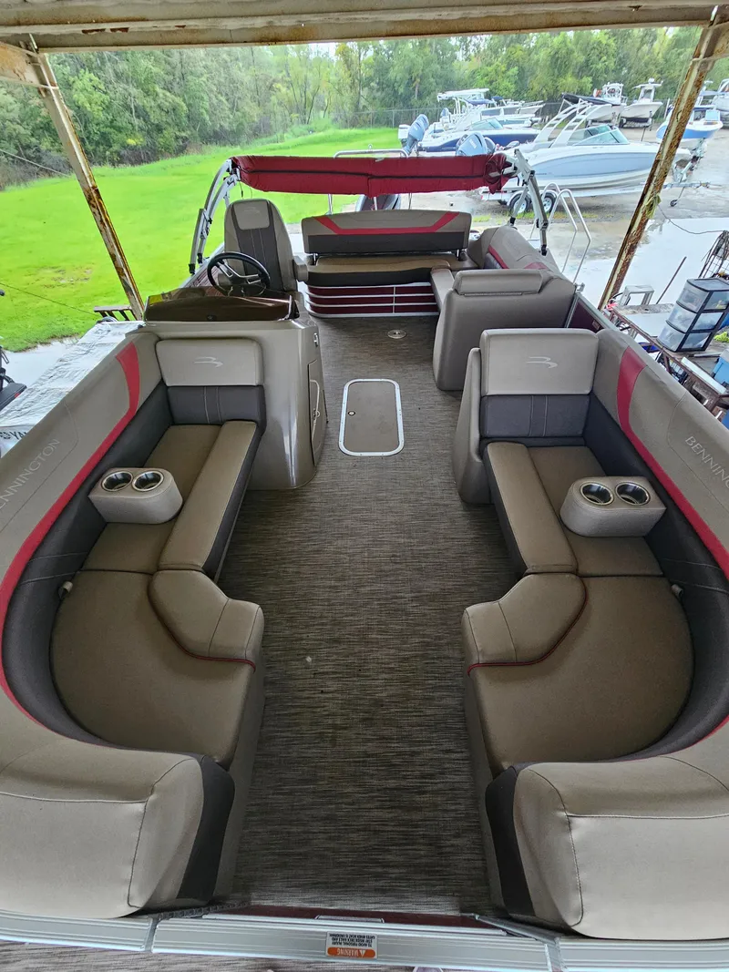 Slide: The Image of 2021 Bennington 22 SX pontoon boat interior with spacious seating and cup holders. - 5