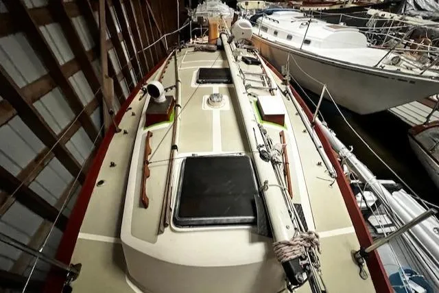 Slide: The Image of 1984 Sea Sprite 34 Yawl sailboat docked in a marina, viewed from above. - 13
