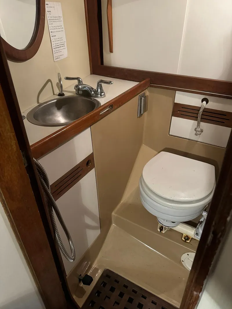 Slide: The Image of 1984 Sea Sprite 34 Yawl bathroom with sink and toilet. - 8