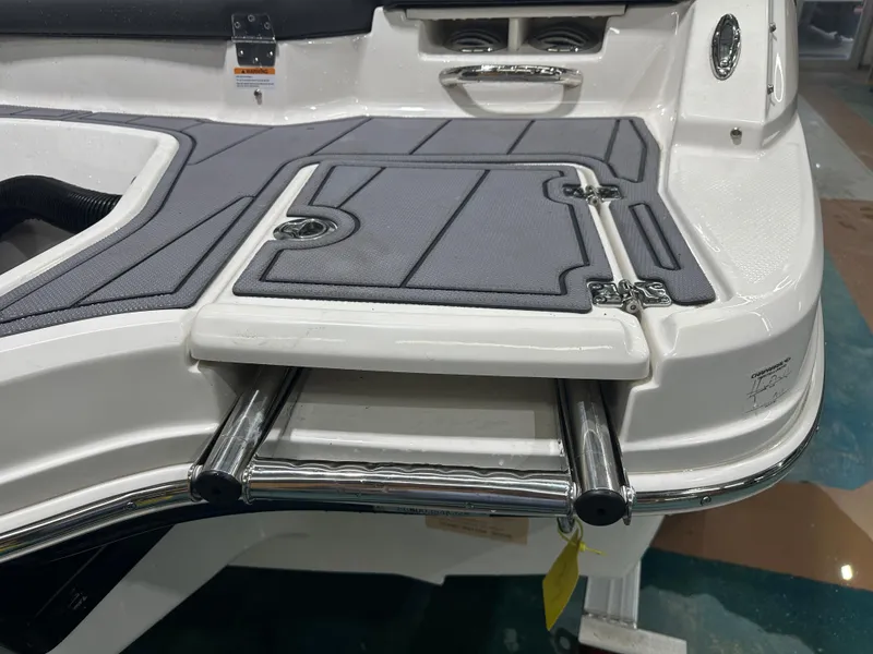 Slide: The Image of 2024 Chaparral SSI21SP boat swim platform with foldable ladder and non-slip surface. - 10