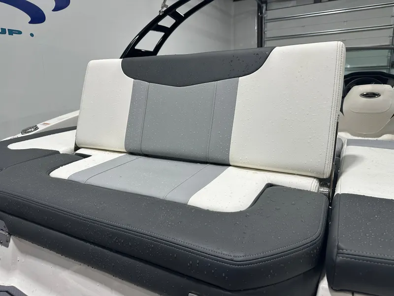 Slide: The Image of 2024 Chaparral SSI21SP boat seat with sleek gray and white upholstery. - 15