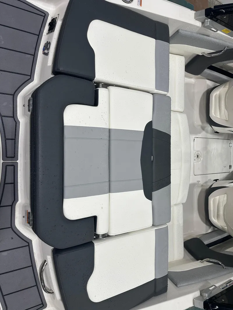 Slide: The Image of 2024 Chaparral SSI21SP boat interior with sleek, modern seating design. - 16
