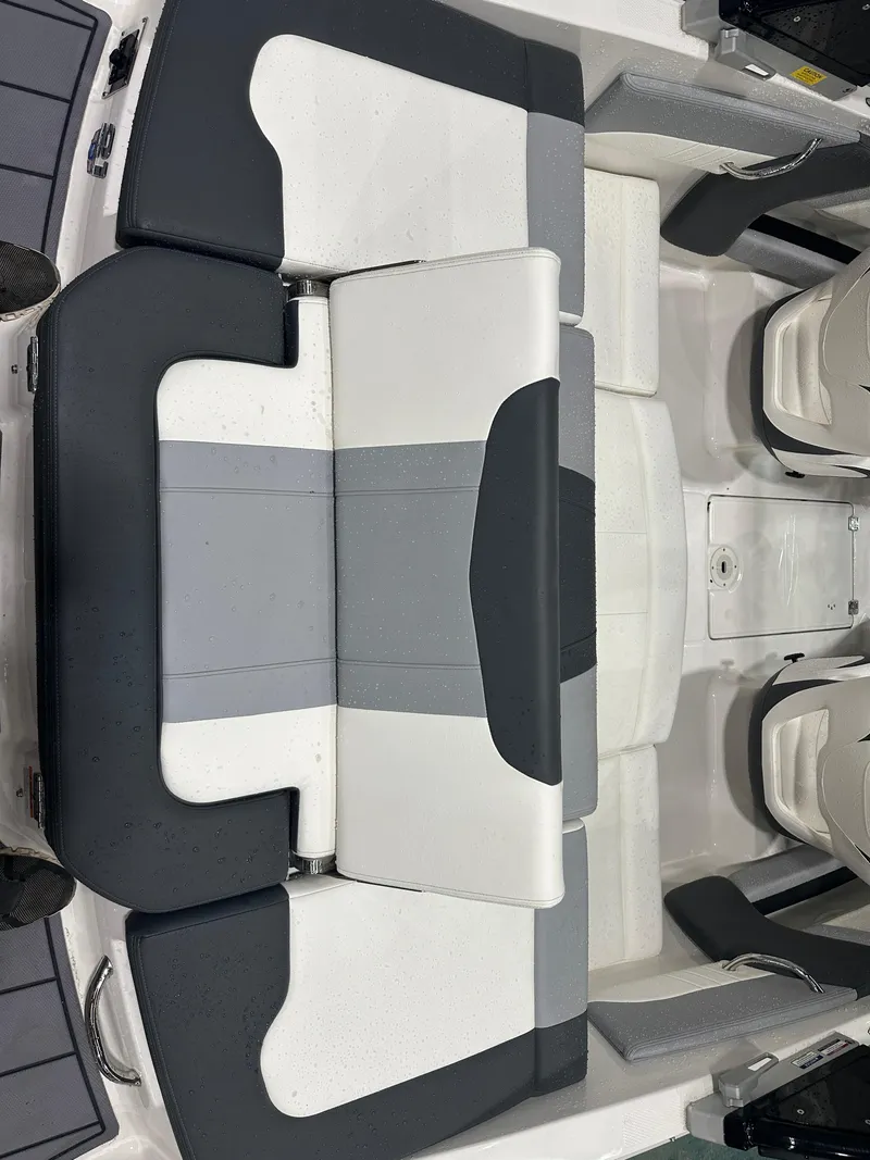 Slide: The Image of 2024 Chaparral SSI21SP boat interior with sleek, modern seating design. - 17