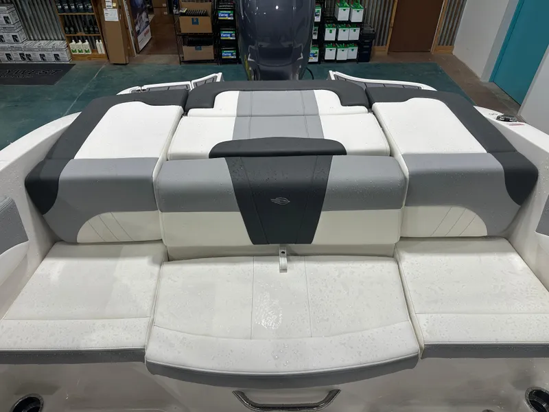 Slide: The Image of 2024 Chaparral SSI21SP boat interior with gray and white cushioned seating. - 20