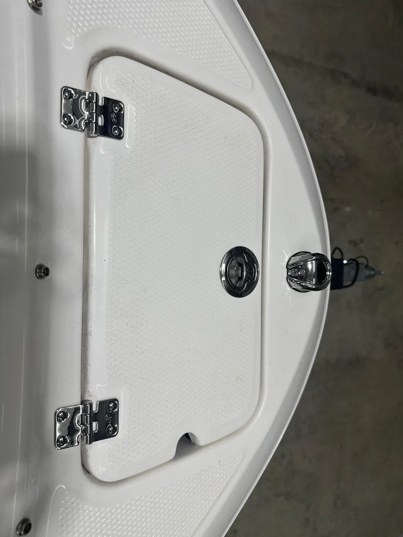 Slide: The Image of 2024 Chaparral SSI21SP boat hatch with stainless steel hinges and latch. - 38