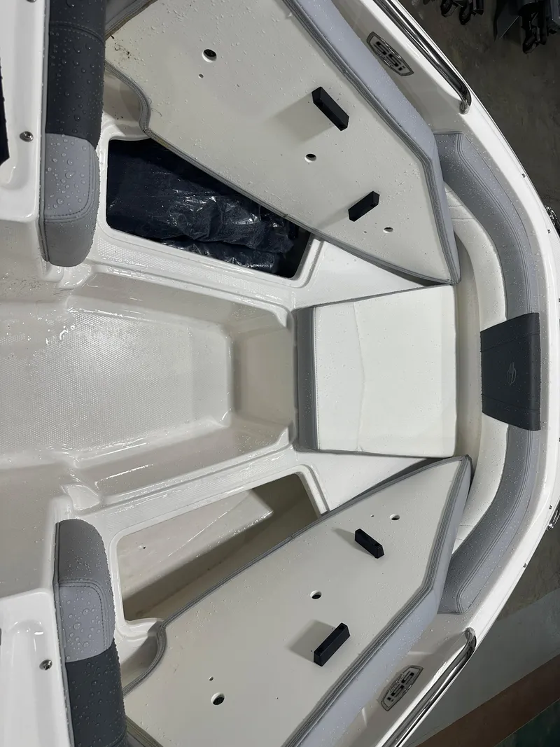 Slide: The Image of 2024 Chaparral SSI21SP boat interior with open storage compartments. - 40