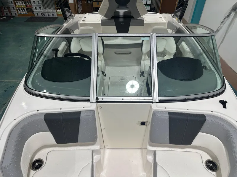 Slide: The Image of 2024 Chaparral SSI21SP boat interior with seating and windshield, viewed from above. - 42
