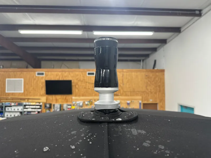 Slide: The Image of 2024 Chaparral SSI21SP boat antenna in a showroom setting. - 44