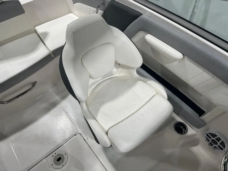 Slide: The Image of 2024 Chaparral SSI21SP boat interior with white seating and modern design. - 45