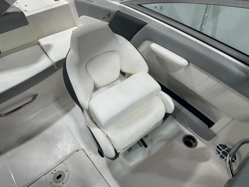 Slide: The Image of 2024 Chaparral SSI21SP boat interior with white seating and modern design. - 46