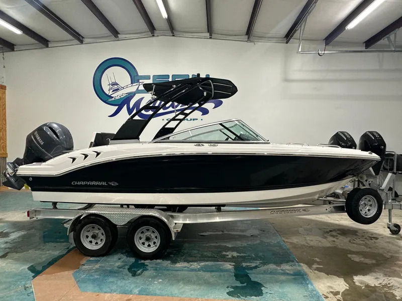 Slide: The Image of 2024 Chaparral SSI21SP boat on trailer in showroom with Yamaha engines. - 5