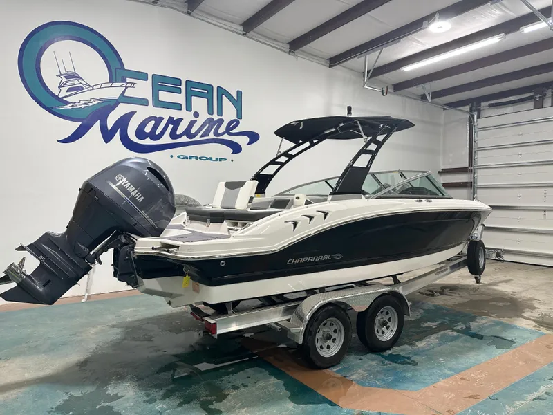 Slide: The Image of 2024 Chaparral SSI21SP boat on trailer in Ocean Marine Group showroom. - 6
