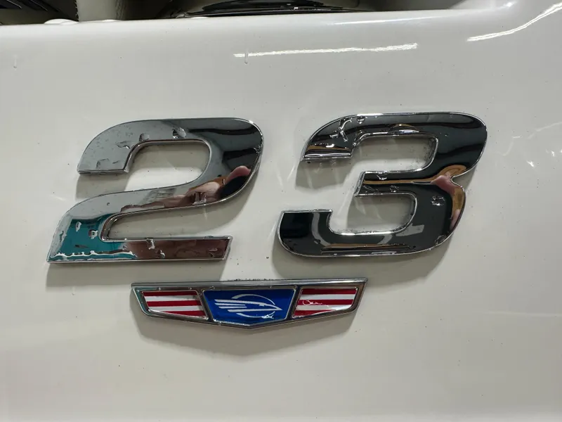 Slide: The Image of Chrome "23" emblem on 2024 Chaparral SSI23SP boat. - 17