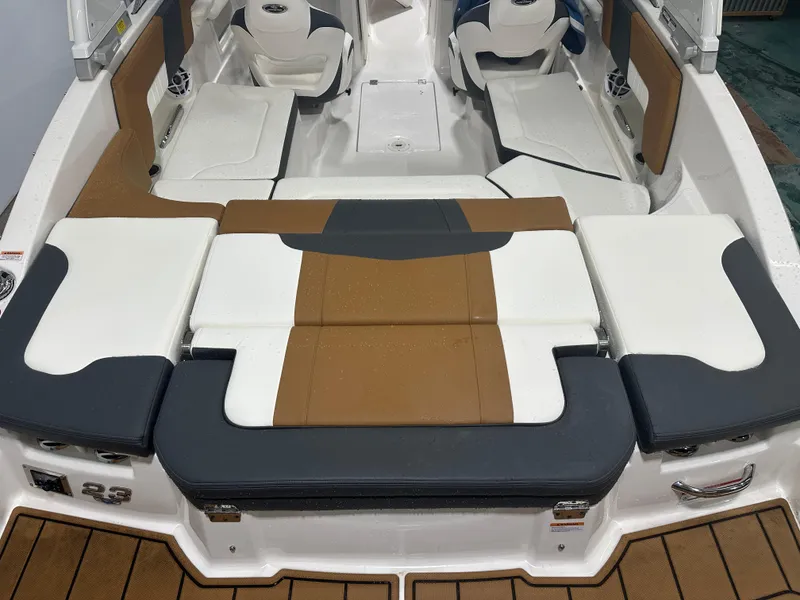 Slide: The Image of 2024 Chaparral SSI23SP boat interior with cushioned seating and modern design. - 18