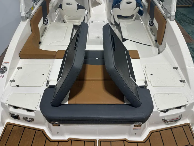 Slide: The Image of 2024 Chaparral SSI23SP boat interior with adjustable seating and storage compartments. - 20