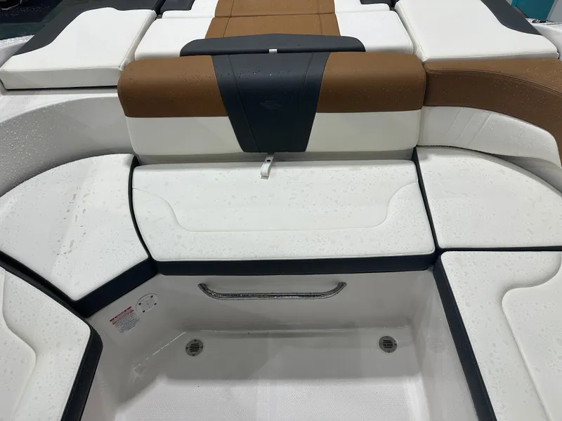 Slide: The Image of 2024 Chaparral SSI23SP boat interior seating with sleek, modern design and wet surfaces. - 23