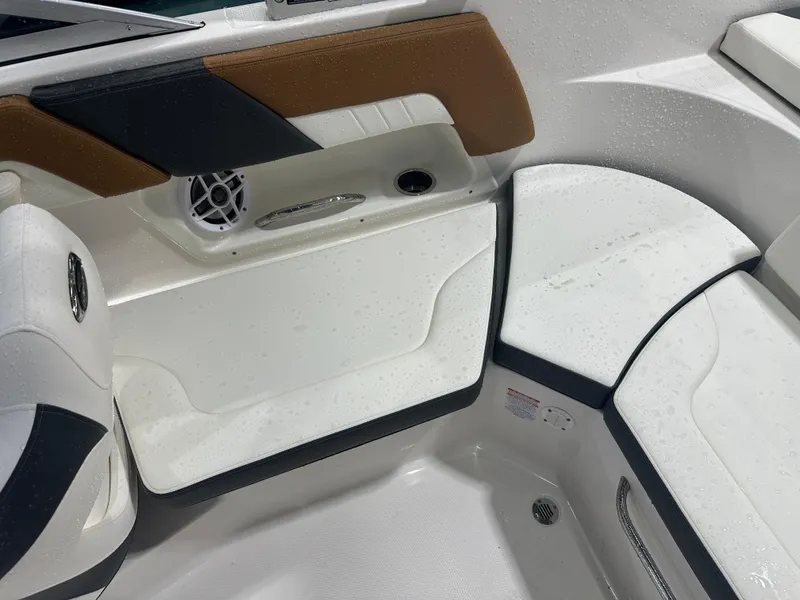 Slide: The Image of 2024 Chaparral SSI23SP boat interior with wet seating and speaker. - 24
