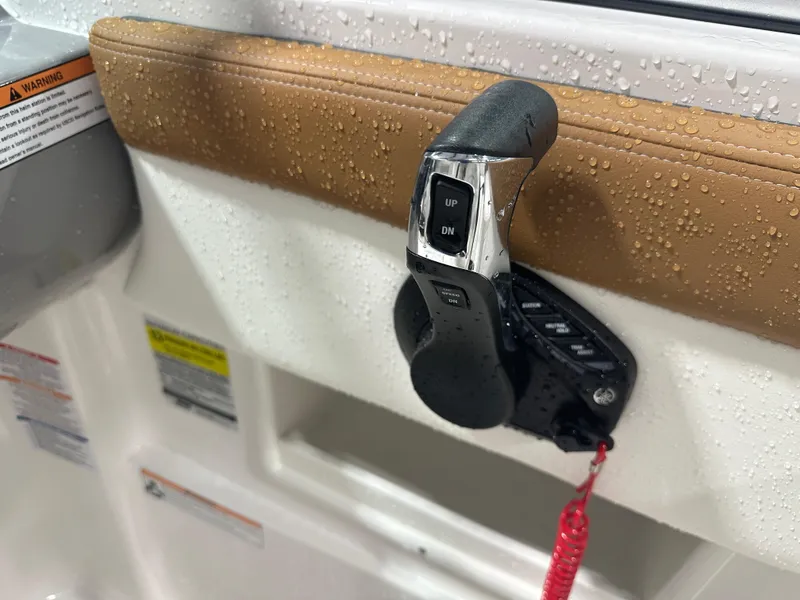 Slide: The Image of 2024 Chaparral SSI23SP boat throttle control with water droplets. - 29