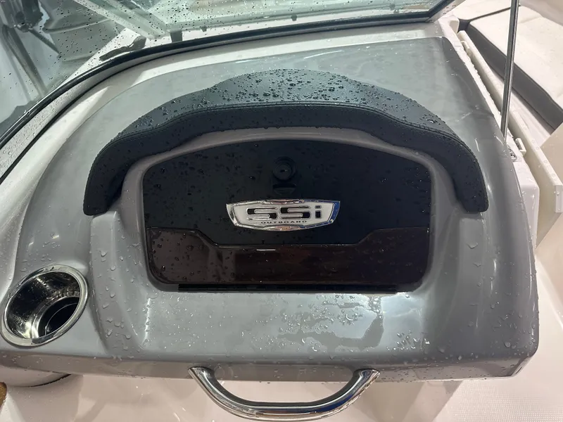 Slide: The Image of 2024 Chaparral SSI23SP dashboard with wet surface and cup holder. - 36