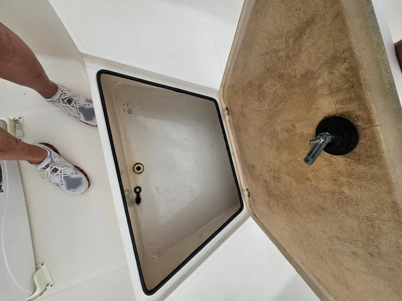 Slide: The Image of Open storage compartment on a 2005 Key West 2020CC boat deck. - 10