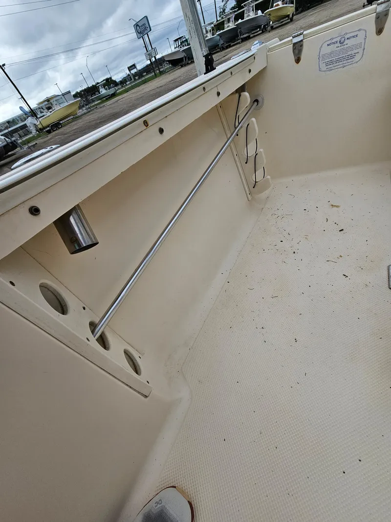 Slide: The Image of Interior of a 2005 Key West 2020CC boat showing rod holders and deck. - 12