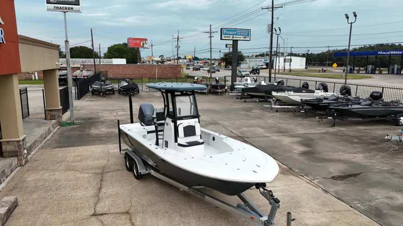Slide: The Image of 2023 Tidewater 2410BM boat on trailer at dealership lot. - 11