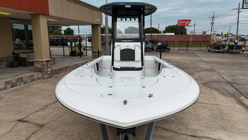 Slide: The Image of 2023 Tidewater 2410BM boat displayed outdoors at a dealership. - 15