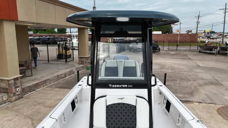 Slide: The Image of 2023 Tidewater 2410BM boat displayed in a dealership lot. - 16