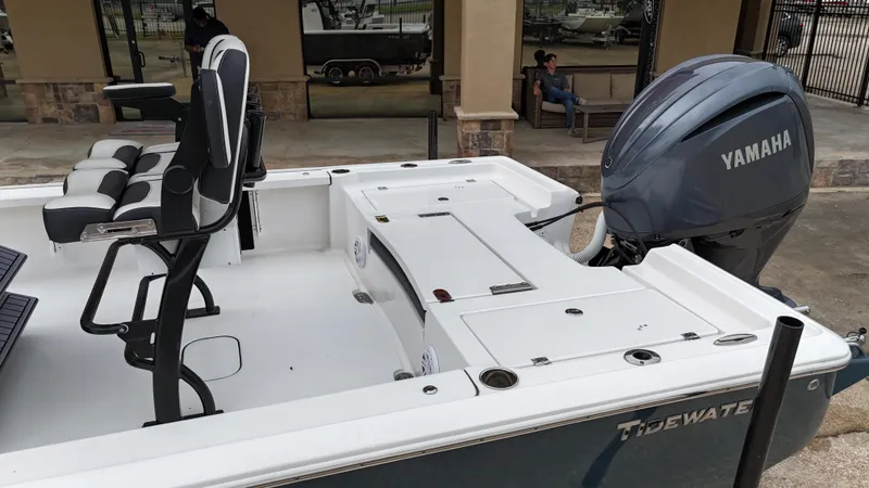 Slide: The Image of 2023 Tidewater 2410BM boat with Yamaha engine, featuring comfortable seating and spacious deck. - 21