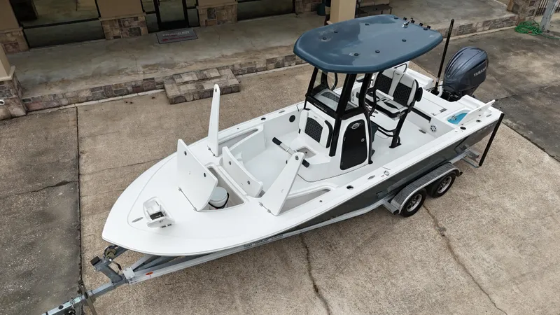 Slide: The Image of 2023 Tidewater 2410BM boat on trailer, featuring sleek design and modern amenities. - 24