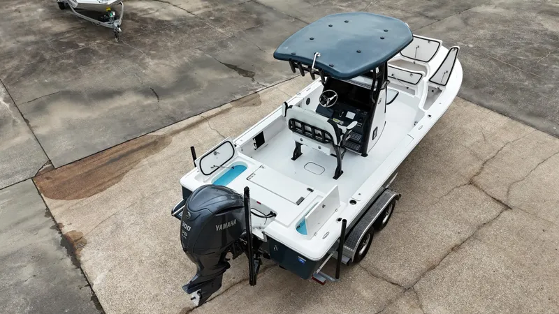 Slide: The Image of 2023 Tidewater 2410BM boat with Yamaha engine on a trailer. - 26