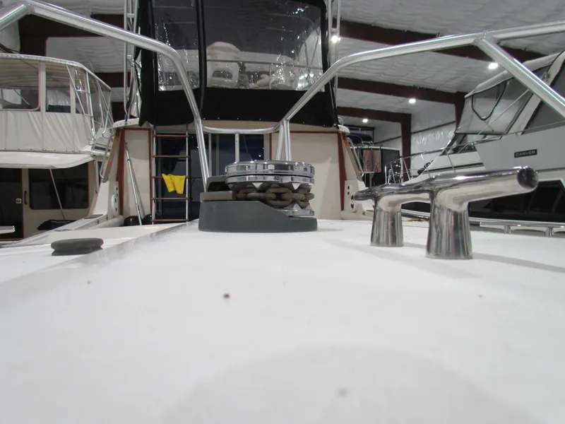 Slide: The Image of Ocean Yachts 48 Sun Sport 2000 model in a marina, showcasing deck details. - 10