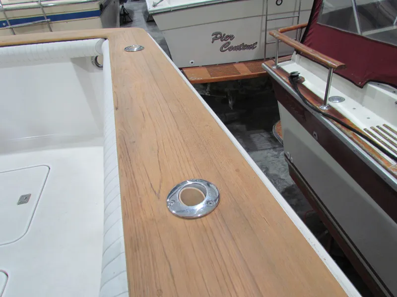 Slide: The Image of Close-up of 2000 Ocean Yachts 48 Sun Sport deck with wooden finish and metal fixtures. - 18